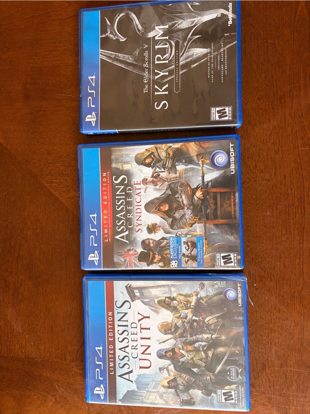 PS4 Game Bundle – Assassin's Creed Unity, Syndicate & Skyrim – Blue Cases